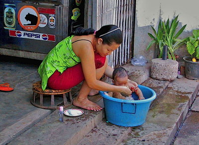 Woman washing baby
