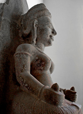 Seated goddess, in profile