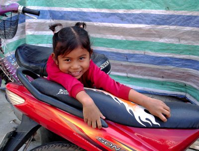 Little girl on motorbike