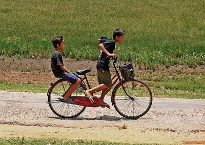 Two boys on a bike