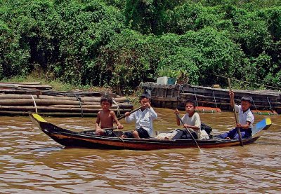 Four boys paddling a boat