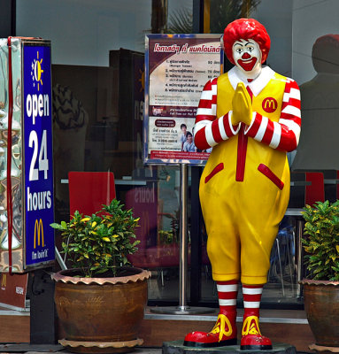 Ronald McDonald greets with a wai