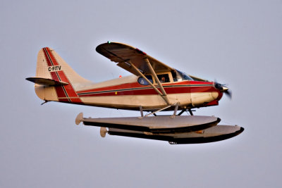 Stinson 180-3 floatplane C-FITV above the Moose River after sunset