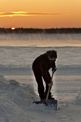 Mark Wesley shovelling snow at dawn December 16, 2008
