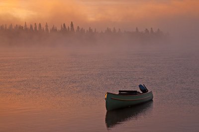 Canoe tied up in fog
