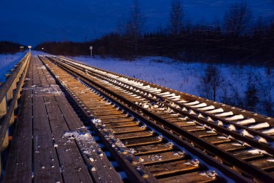 Store Creek bridge illuminated by locomotive headlights