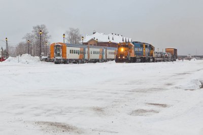 Passenger section of Polar Bear Express at platform while locomotives and head end cars move past to couple on.