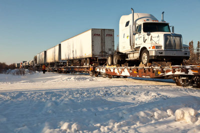 Freight approaching winter road crossing