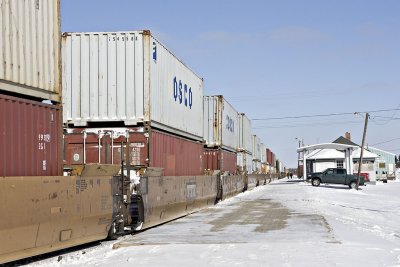Double stacked containers passing Moosonee station
