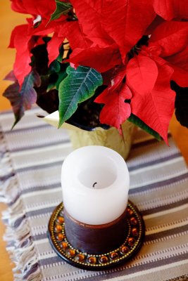 Candle and poinsettia