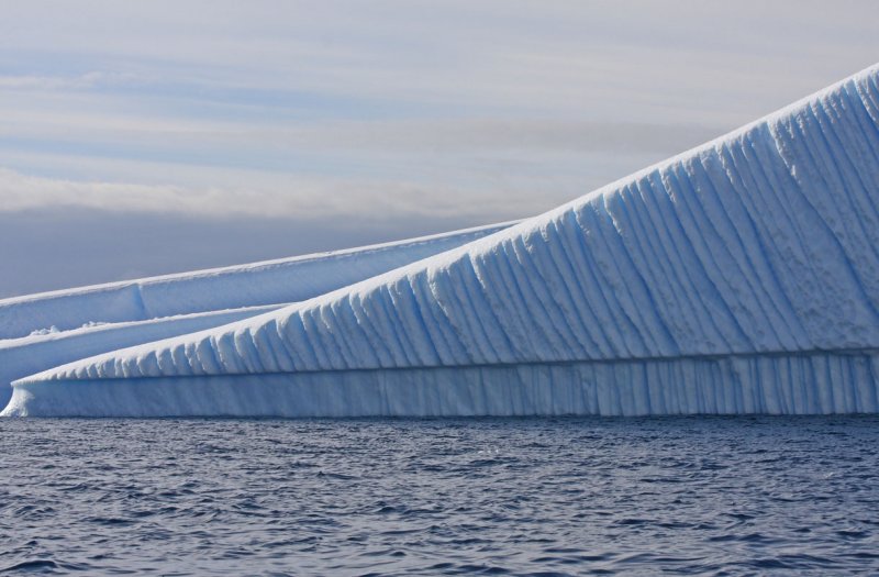 Parallel melt lines on an overturned berg