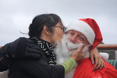 Santa gets a kiss from Lisa