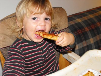 The boy does love his peepas (pizza).