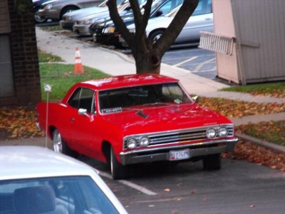 Shot from my balcony. I think it's a '70ish Plymouth, but it;s a little fuzzy to tell.