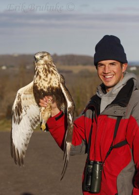 Cameron holding the Rough-legged Hawk