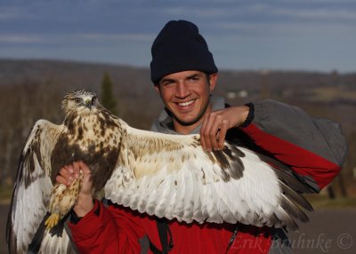 Cameron holding the Rough-legged Hawk
