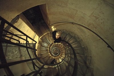 Woman Descending Spiral Staircase