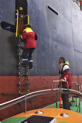 Pilot boards an inbound container ship at Lyttelton, New Zealand.