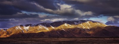 Panorama of light and shadow on mountains, Mackenzie Country, Canterbury, New Zealand