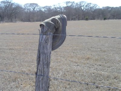 Boot on fence post