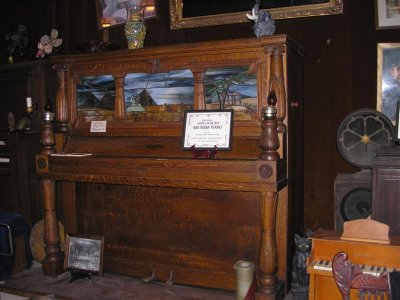 This hand carved and painted piano came out of a bar