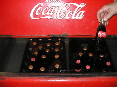 This antique coke machine  uses cold water for frig