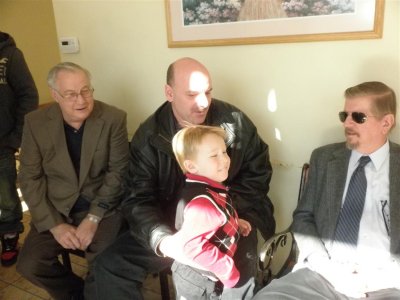 Zach with Uncle Rich, Grandpas' Rolf & Ken too