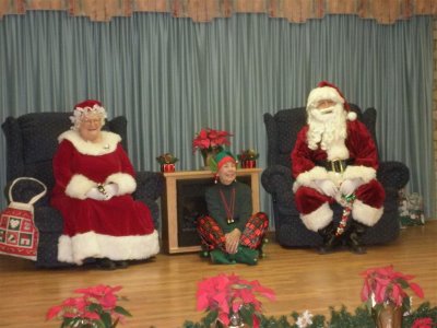 Mr and Mrs Claus with Elf