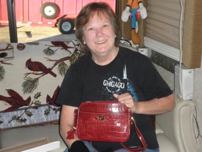 He surprised her with a perfect purse too !