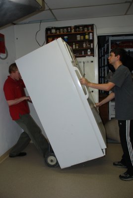 Brian and Alex moving the frig for the kitchen renovation
