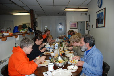 Staff, volunteers and EduTrippers enjoying a meal together