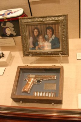 The gun and photo, gifts to the President on display