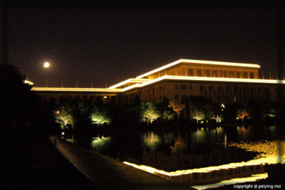 Full moon over the Great Hall of the People at Tiananmen Square