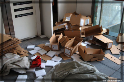 Boxes of packaging materials are tossed out from the back door