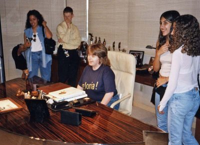 Val at Emilio's desk