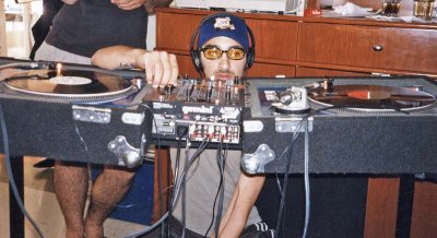 Nayib gets his DJ equipment ready
