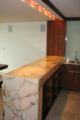 Penthouse bar with solid onyx surface