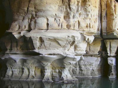 Limestone pillars reflect in the water in the entrance hall to the Sof Omar Cave system, Ethiopia