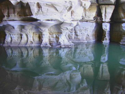 Limestone pillars reflect in the water in the entrance hall to the Sof Omar Cave system, Ethiopia
