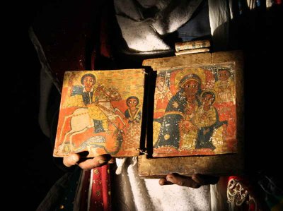 Monk displaying the church treasures, Asheton Maryam