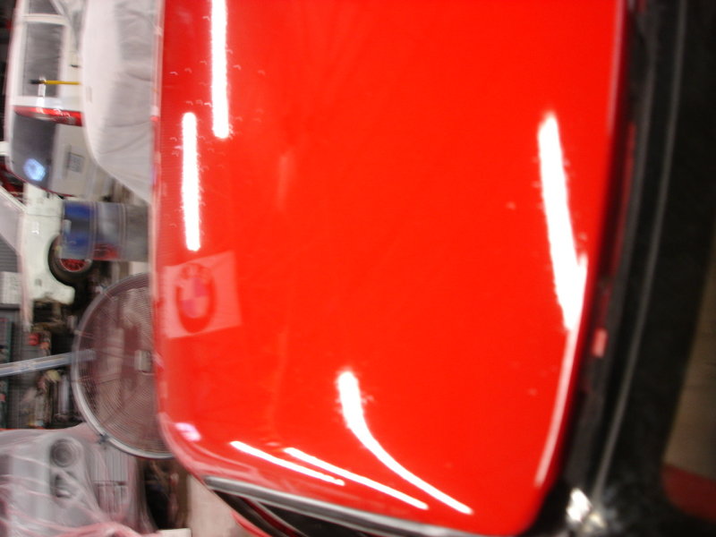 You can read BMW in the reflection of the flag