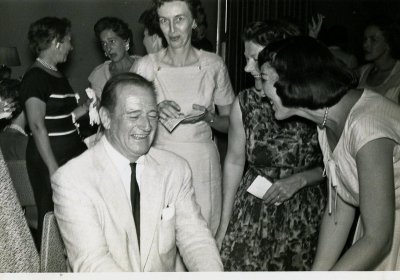 John Wayne And Fawning Ladies
