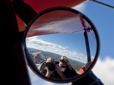 My dad and I  (and the pilot) in the review mirror of the 1929 New Standard.