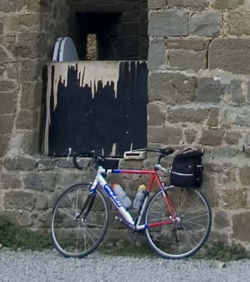 My ride, waiting against the wall inside the fort at Montalcino