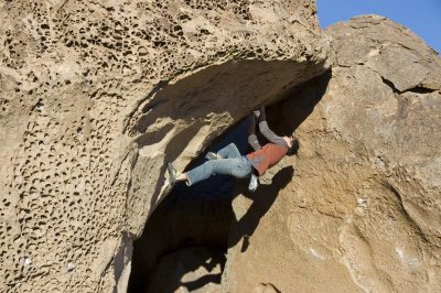 Done With the South V5 at the mouth of the Water Saps cave, Bishop.