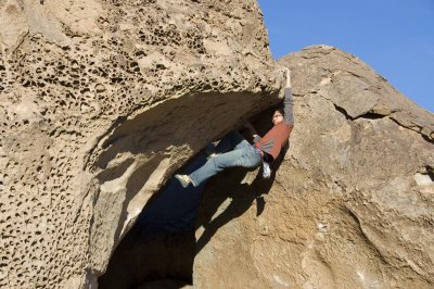 Done With the South V5 at the mouth of the Water Saps cave, Bishop.