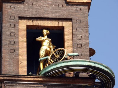 On the building of Unibank.
This is a unique barometer.When the weather forecast is good,a young girl come out on a bicycle,but when the weather forecast is rainy the girl come out with umbrella.