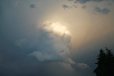 Storm clouds backlit by the sun