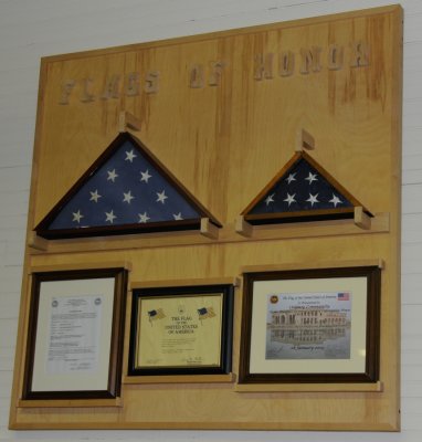 Chad presented the Oolenoy family this U. S. Flag, on the right, that had flown over Baghdad