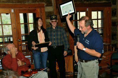 John and his granddaughter receiving their I HikedTable Rock certificates